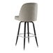 A Lancaster Table & Seating black swivel barstool with gray vinyl bucket seat.