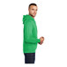 A man wearing a Clover Green Port & Company Core Fleece pullover hoodie.