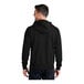 A man wearing a Port & Company black fleece full-zip hoodie.