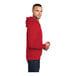 A man wearing a red Port & Company Core Fleece pullover hoodie.