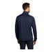 A man in an extra small Port Authority navy blue quarter-zip pullover with iron gray accents.