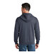 A man wearing a Port & Company heather navy full-zip fleece hoodie.