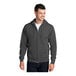 A man wearing a Port & Company charcoal core fleece full-zip hoodie.