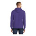 A man wearing a purple Port & Company Core Fleece pullover hoodie.