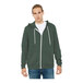 A man wearing a military green Bella + Canvas zip-up hoodie.