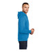 A person wearing a Port & Company Sapphire Core Fleece pullover hoodie in blue.