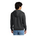 A man wearing a charcoal grey District sweatshirt hoodie.