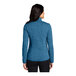 A woman wearing a Port Authority blue heather fleece jacket.