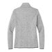 A close-up of a grey Port Authority fleece sweater jacket with a zipper.