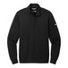 A black Nike Dri-FIT half-zip sweater with a white swoosh.