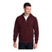 A man wearing a maroon Port & Company full-zip hooded sweatshirt.