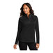 A woman wearing a Port Authority black 1/4 zip sweatshirt.