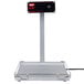 A black and white rectangular Hatco food warmer with a metal bar above it.