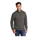 A man wearing a Port & Company charcoal quarter-zip pullover sweatshirt.