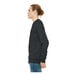 A person wearing a dark gray Bella + Canvas sponge fleece raglan sweatshirt.