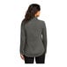 A woman wearing a Port Authority grey quarter-zip sweatshirt.