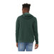 A man wearing a Bella + Canvas Heather Forest green pullover hoodie.