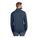 A TravisMathew men's navy blue fleece quarter-zip pullover with long sleeves.