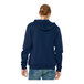 A man wearing a navy Bella + Canvas full-zip hoodie.