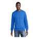 A man wearing a Port & Company royal blue crewneck sweatshirt.