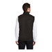 A man wearing a black heather Port Authority fleece sweater vest with a zipper closure.