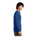 A man wearing a District deep royal blue fleece crewneck sweatshirt.