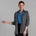 A woman wearing a blue shirt and Edwards Smoke Heather cardigan.