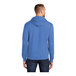 A person wearing a blue Port & Company Core Fleece pullover hoodie
