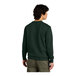 A man wearing a District forest green V.I.T. fleece crewneck sweatshirt.