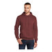 A man wearing a maroon Port & Company Core Fleece pullover hoodie.