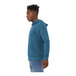 A person wearing a Bella + Canvas heather deep teal sponge fleece pullover hoodie