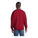 A man wearing a red Port & Company core fleece sweatshirt.