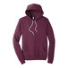 A maroon Bella + Canvas sponge fleece pullover hoodie with white strings.
