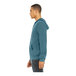 A man wearing a Bella + Canvas heather deep teal full-zip hoodie.
