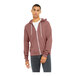 A person wearing a mauve Bella + Canvas zip-up hoodie.