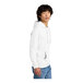 A person wearing a white District sweatshirt with a hood.