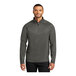 A man wearing a grey Port Authority quarter-zip sweatshirt.