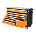 A black and orange Gearwrench tool box with drawers and wheels.