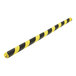 A black and yellow striped Vestil polyurethane foam edge guard with a 5/16" slot.