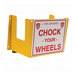 A yellow steel wall-mounted Wheel Chock holder with red text.