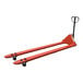 A red Vestil steel pallet truck with black handles and wheels.