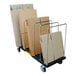 A Vestil steel cart with cardboard boxes in racks.