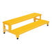 A yellow metal Vestil two-step adjustable step stool.