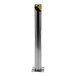 A close up of a stainless steel pole with a yellow and black stripe.