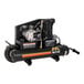 A black Mi-T-M air compressor with red accents and wheels.