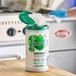 A white container of Seventh Generation multi-surface wipes with a green lid.