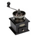 A Fox Run black coffee handgrinder with a wooden base and metal handle.
