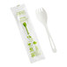 A wrapped World Centric compostable spork with a green and white label.