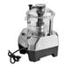 A commercial-grade food processor with a clear 5-quart batch bowl and a sturdy base.