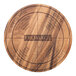 An Ironwood circular acacia wood serving board with the word "Fromage" engraved in it.